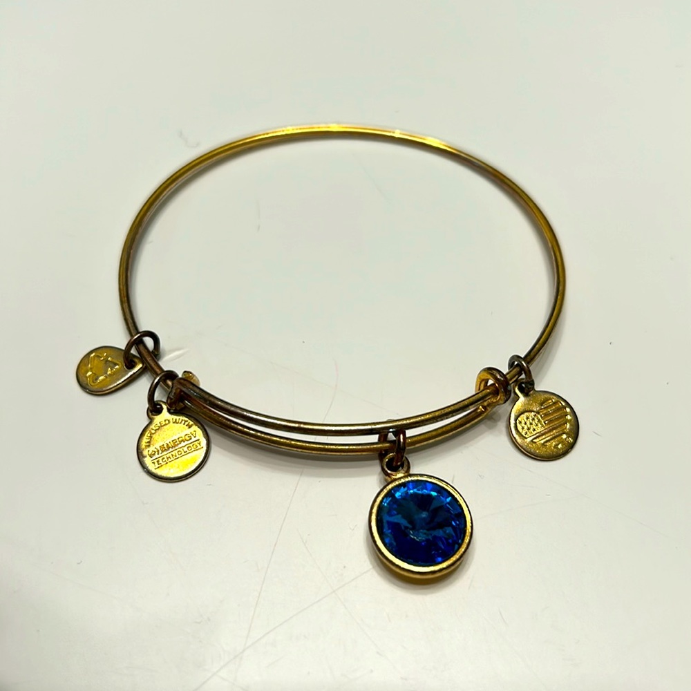 Gold with dark blue gem Alex & Ani bracelet